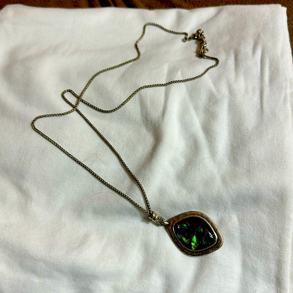 Long mother of pearl necklace 22”silver in color